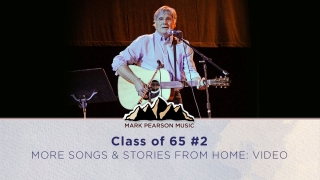 Picture of Mark Pearson singing on stage at the Class of '65 concert
